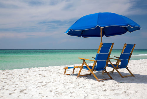 Beach chairs and umbrella rentals at Kiva Dunes